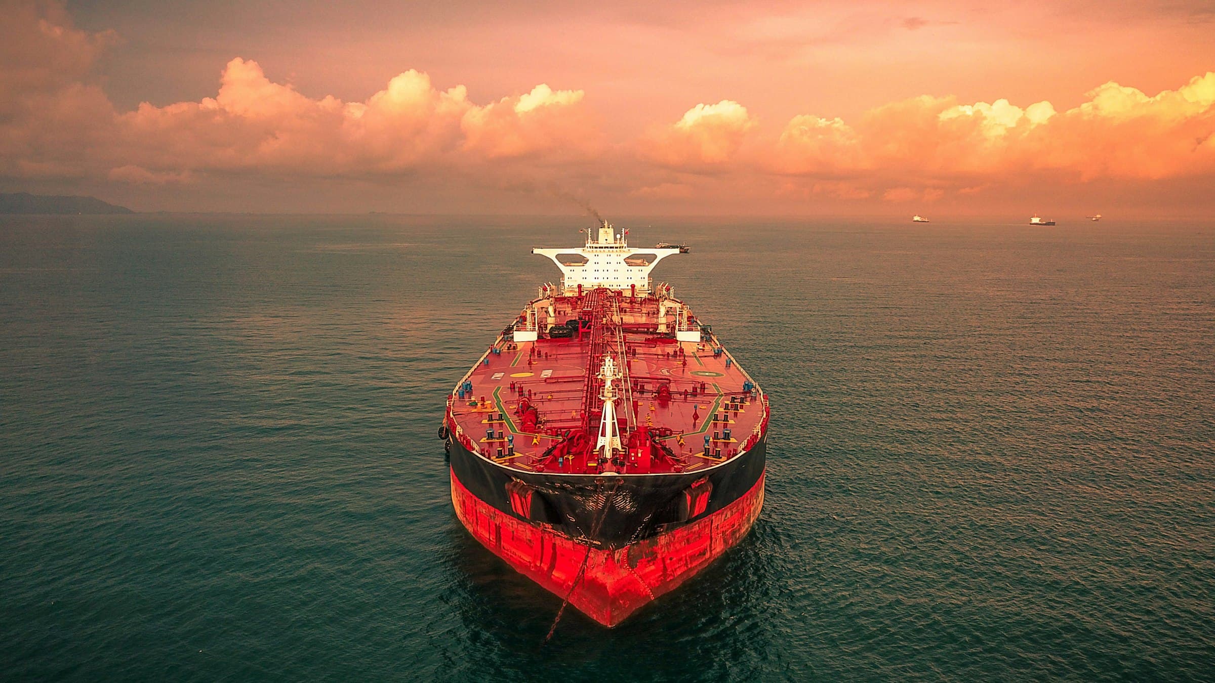 Aerial view of a loaded tanker under way at sea at dusk